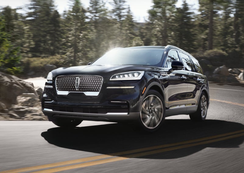 A Lincoln Aviator® SUV is being driven on a winding mountain road | Carman Lincoln in New Castle DE