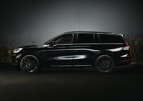 A 2024 Lincoln Aviator® SUV is shown in the Infinite Black exterior color | Carman Lincoln in New Castle DE