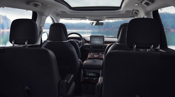 The interior of a 2024 Lincoln Aviator® SUV from behind the second row | Carman Lincoln in New Castle DE