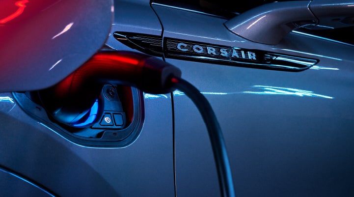 A charger plugged into the charging port of a 2024 Lincoln Corsair® Plug-in Hybrid model. | Carman Lincoln in New Castle DE