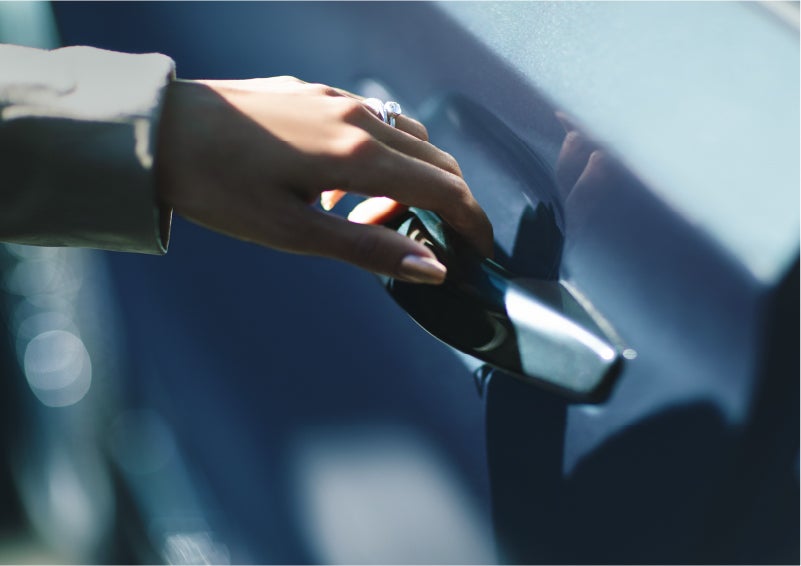 A hand gracefully grips the Light Touch Handle of a 2023 Lincoln Aviator® SUV to demonstrate its ease of use | Carman Lincoln in New Castle DE