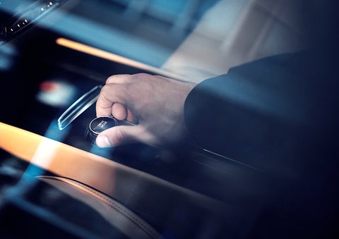 The driver of a 2023 Lincoln Corsair® SUV is shown adjusting the drive mode. | Carman Lincoln in New Castle DE