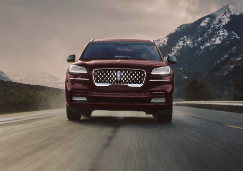 A 2024 Lincoln Aviator® SUV is shown in the Diamond Red exterior color. | Carman Lincoln in New Castle DE