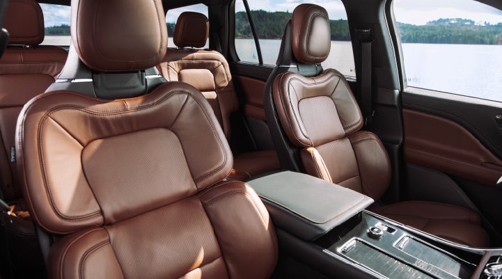 The front row's Perfect Position Seats in a 2024 Lincoln Aviator® Reserve model with Ebony Roast interior | Carman Lincoln in New Castle DE