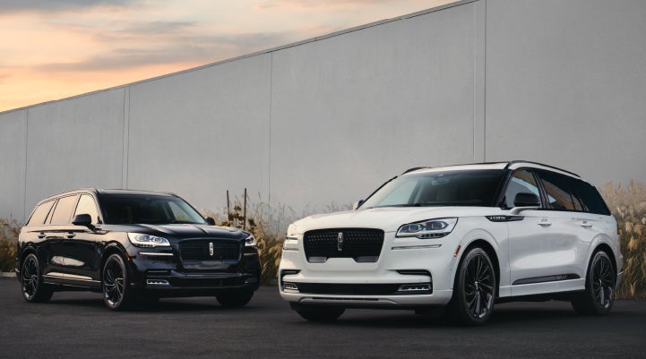 Two Lincoln Aviator® SUVs are shown with the available Jet Appearance Package | Carman Lincoln in New Castle DE