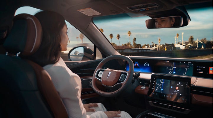 A person is shown driving hands-free on the highway with available Lincoln BlueCruise technology. | Carman Lincoln in New Castle DE