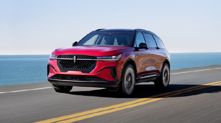 A 2025 Lincoln Nautilus® SUV is being driven on a seaside roadway. | Carman Lincoln in New Castle DE