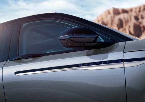 Blue lettering on the side of the vehicle that reads nautilus indicates the available hybrid powertrain. | Carman Lincoln in New Castle DE