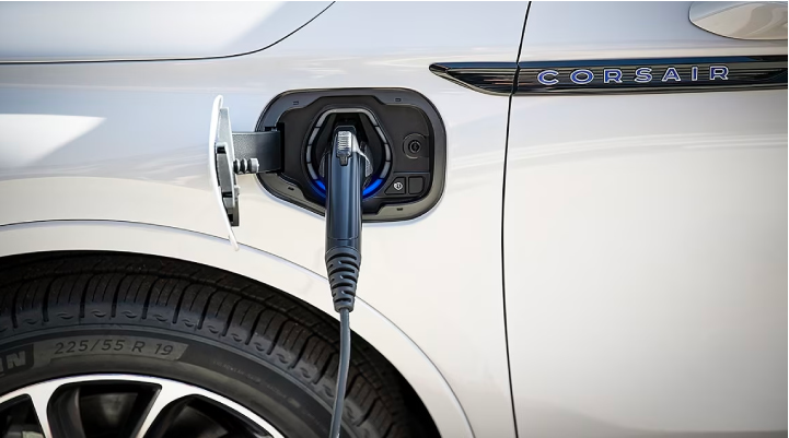 An electric charger is shown plugged into the charging port of a Lincoln Corsair® Grand Touring
model. | Carman Lincoln in New Castle DE