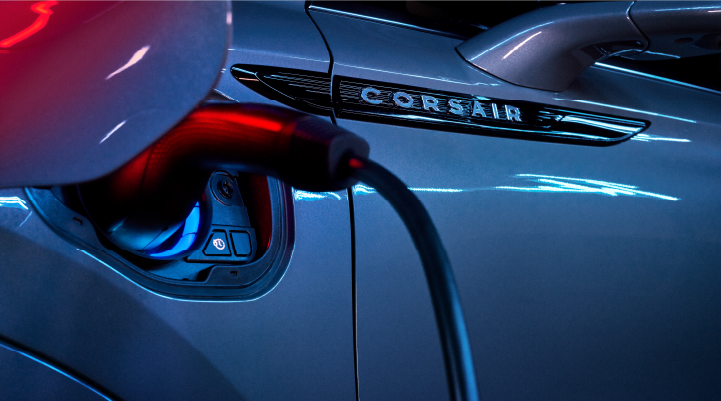 A charger plugged into the charging port of a 2025 Lincoln Corsair® Plug-in Hybrid model. | Carman Lincoln in New Castle DE