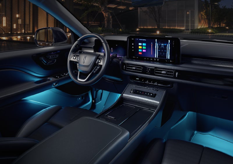 Deep blue ambient lighting glows from various places within a 2026 Lincoln Aviator® SUV. | Carman Lincoln in New Castle DE