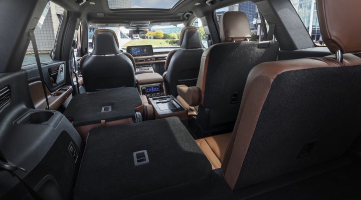 One side of the PowerFold® third-row seat and a second-row seat are folded forward in the 2026 Lincoln Aviator® SUV. | Carman Lincoln in New Castle DE