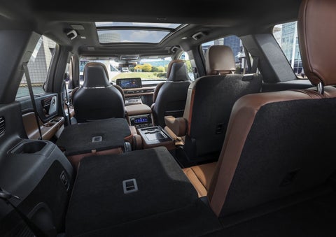 One side of the PowerFold® third-row seat and a second-row seat are folded forward in the 2026 Lincoln Aviator® SUV. | Carman Lincoln in New Castle DE
