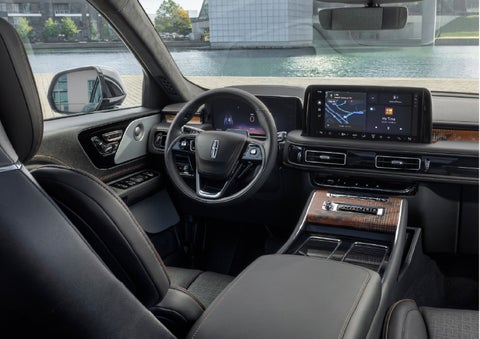 The interior of the 2026 Lincoln Aviator® SUV is shown parked with a view of a harbor through the windshield. | Carman Lincoln in New Castle DE