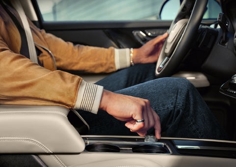 The driver of a 2026 Lincoln Corsair® SUV is shown selecting a drive mode. | Carman Lincoln in New Castle DE