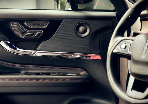 An audio speaker is shown in the driver's side door of a 2026 Lincoln Corsair® SUV | Carman Lincoln in New Castle DE