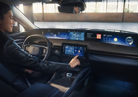 The driver of a 2026 Lincoln Nautilus® SUV interacts with the center touchscreen. | Carman Lincoln in New Castle DE