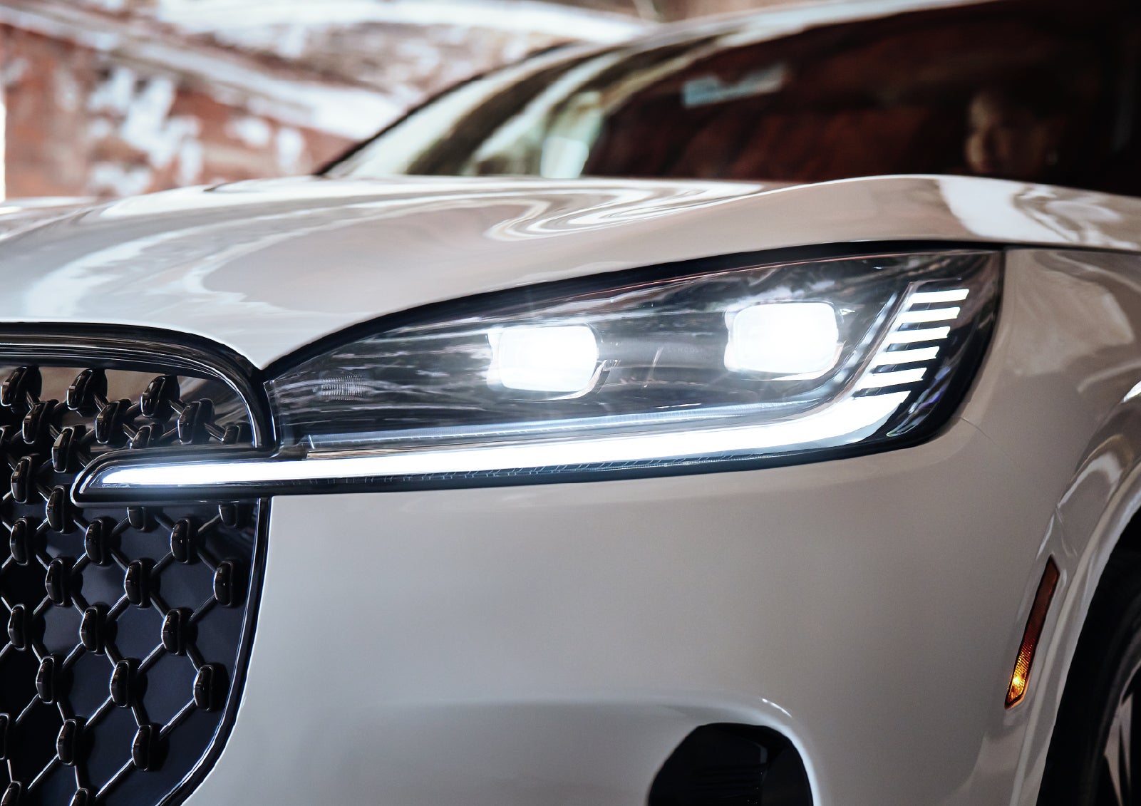 A close-up of a headlamp on the 2027 Lincoln Aviator® SUV is shown. | Carman Lincoln in New Castle DE