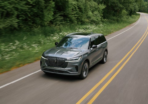 A 2027 Lincoln Aviator® SUV is being driven down a road. | Carman Lincoln in New Castle DE