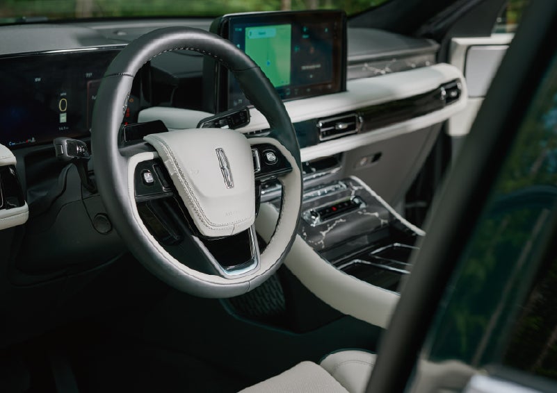 The leather-trimmed steering wheel of a 2027 Lincoln Aviator® Black Label™ SUV. | Carman Lincoln in New Castle DE